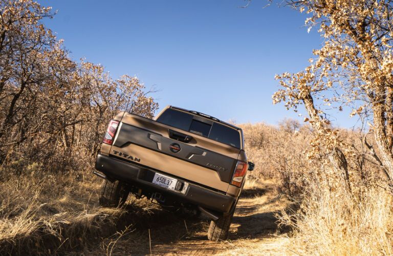 A photo of the 2021 Nissan Titan crossing uneven road.