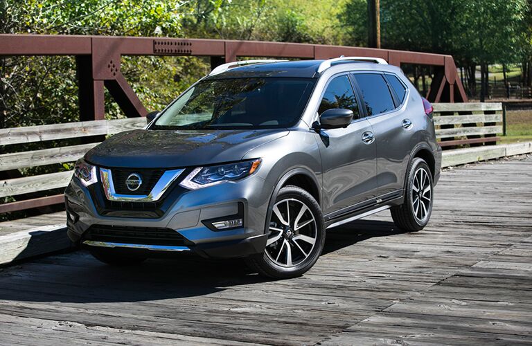 A front left quarter photo of the 2018 Nissan Rogue on a bridge.