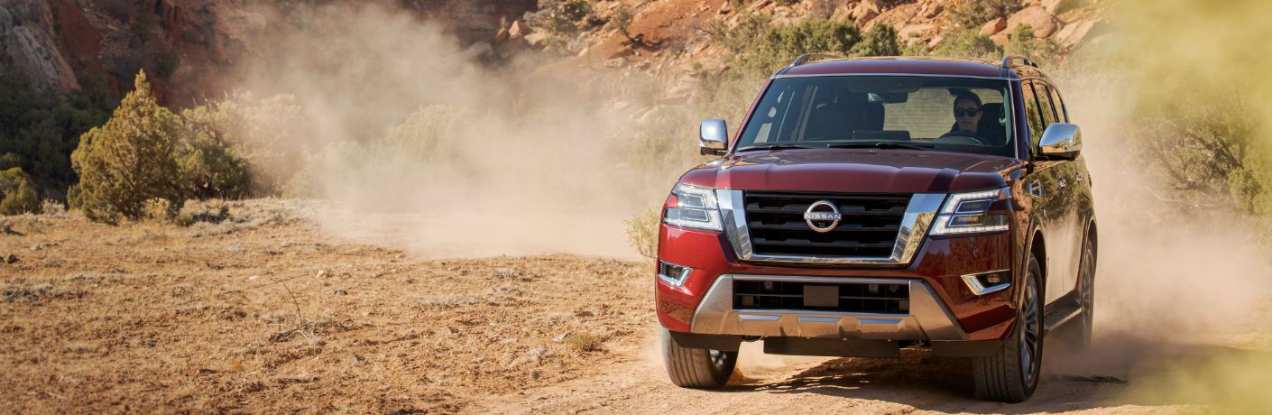 A head-on photo of the 2021 Nissan Armada coming through the desert.