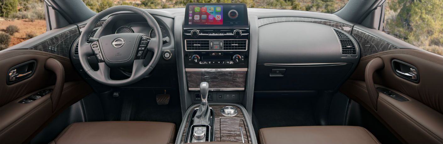 A photo of the dashboad and driver's cockpit in the 2021 Nissan Armada.