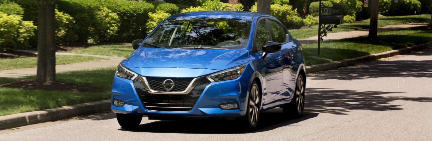 A front left quarter photo of the 2021 Nissan Versa on the road.