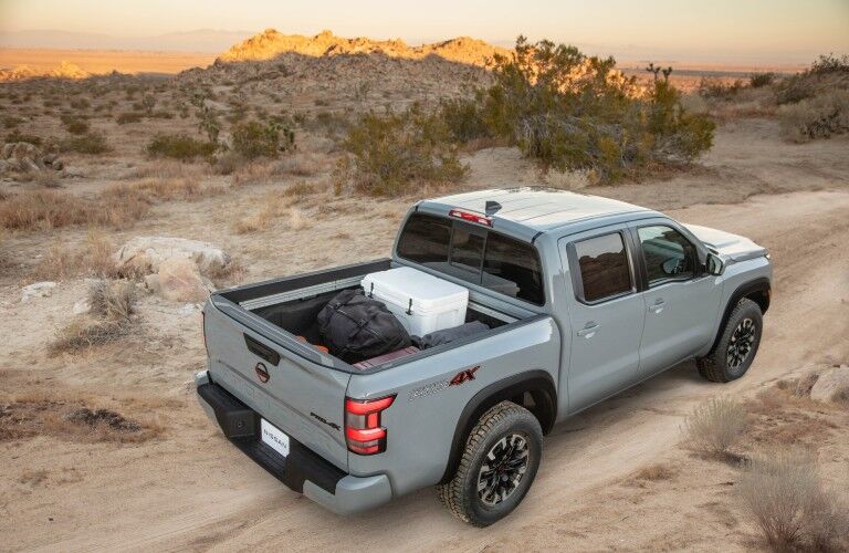 A photo of the 2022 Nissan Frontier with a cargo bed full of cargo.