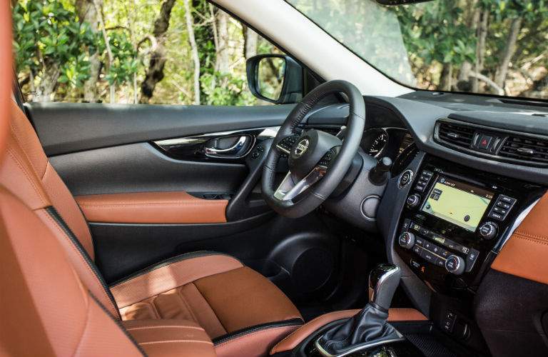 An interior photo showing the driver's cockpit in the 2018 Rogue including the infotainment system