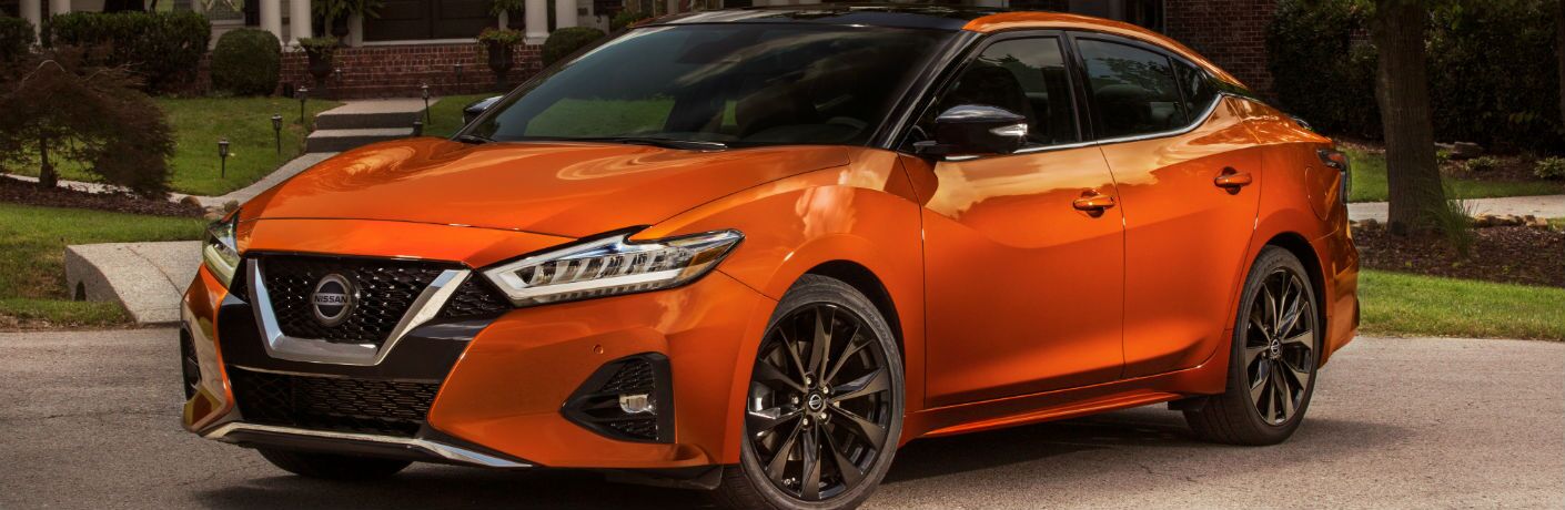A front left quarter photo of the 2020 Nissan Maxima in a driveway.