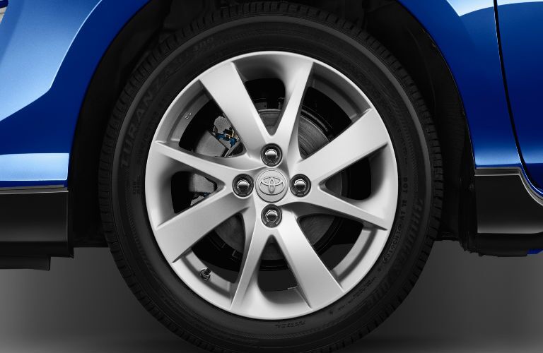 Close Up of 2017 Toyota Prius c Wheels with blue Exterior
