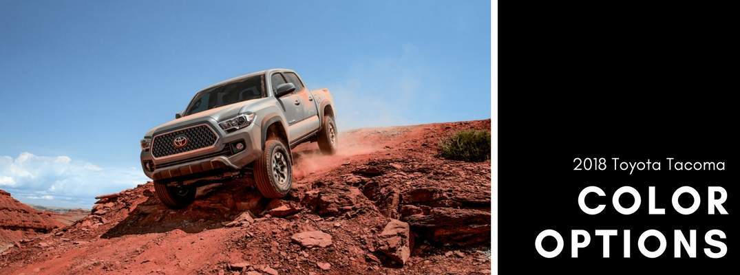 tan 2018 Toyota Tacoma driving down rocky decline next to color options wording