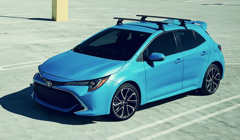 teal 2019 Toyota Corolla Hatchback parked in parking lot