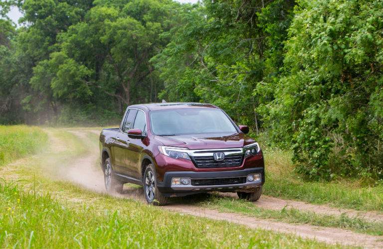 A front view photo of a 2018 Honda Ridgeline coming down a trail