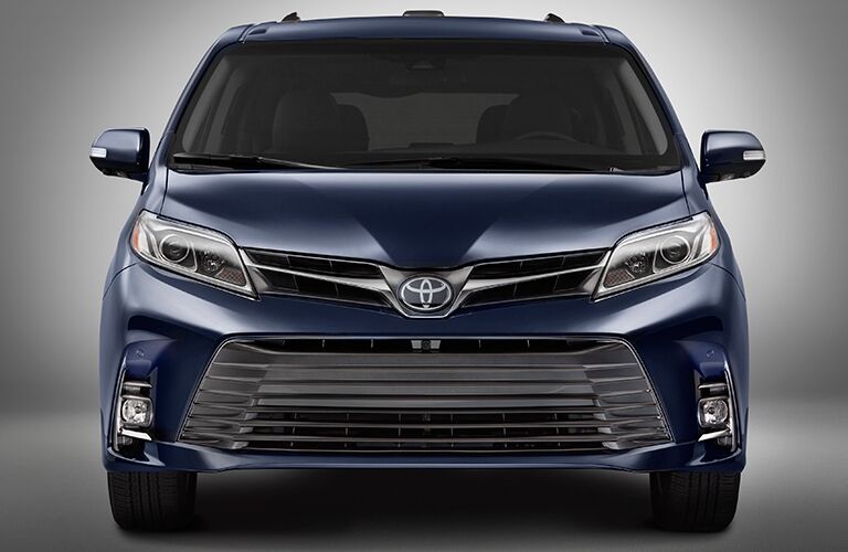 front view of blue 2018 toyota sienna against white background