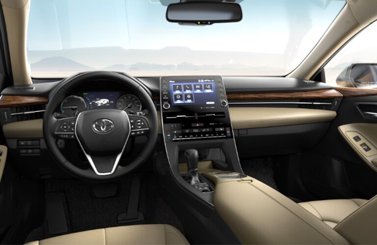 front interior of 2019 toyota avalon hybrid including steering wheel and center infotainment system
