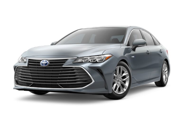 front and rear view of silver 2019 toyota avalon hybrid against white background