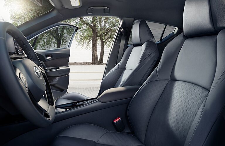 side view of front interior of 2019 toyota c-hr including steering wheel and center console