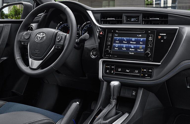 front interior of 2019 toyota corolla including steering wheel and infotainment system