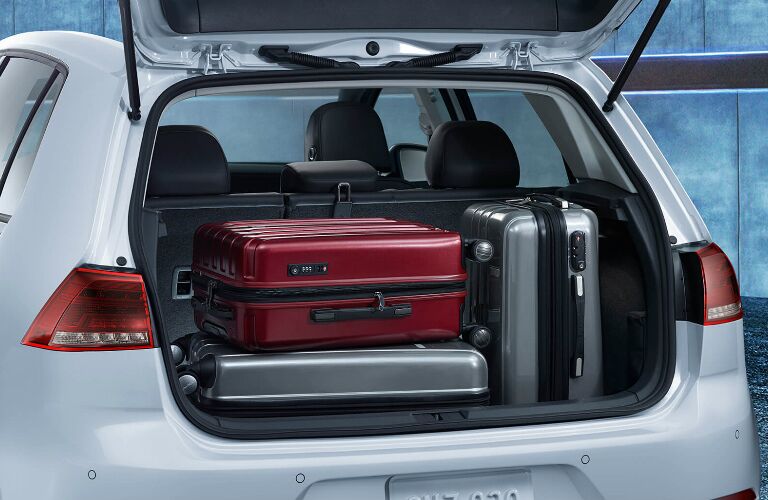 Luggage in the cargo area of a white 2019 Volkswagen e-Golf