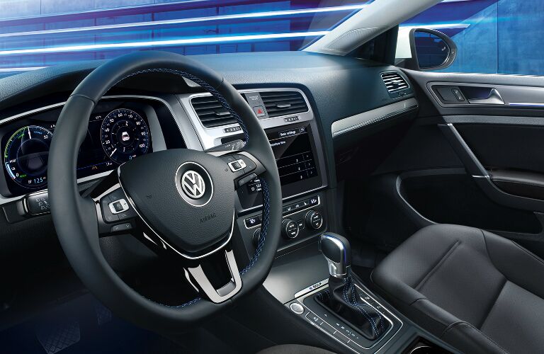 Dashboard and dark grey front seats in 2019 Volkswagen e-Golf