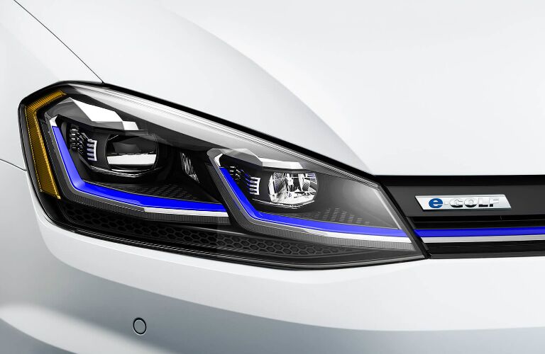 Headlights and badge on white 2019 Volkswagen e-Golf