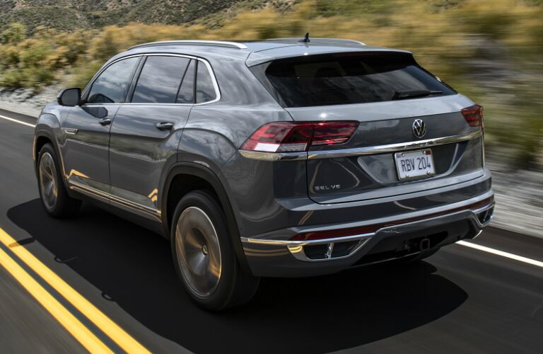 Driver's side rear angle view of grey 2020 Volkswagen Atlas Cross Sport