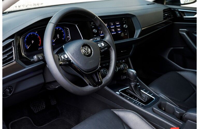 2019 Volkswagen Jetta interior driver's seat view angle of steering wheel, transmission, and dashboard
