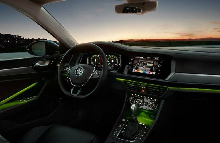 2019 Volkswagen Jetta front dash with green ambient lighting