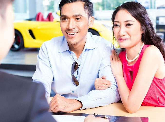 Happy Couple Buying Used Car