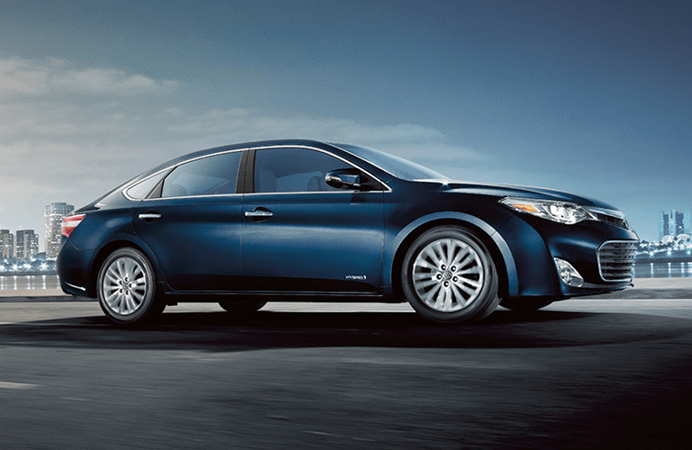 Toyota Avalon Driving Through City Front End and Side View in Navy
