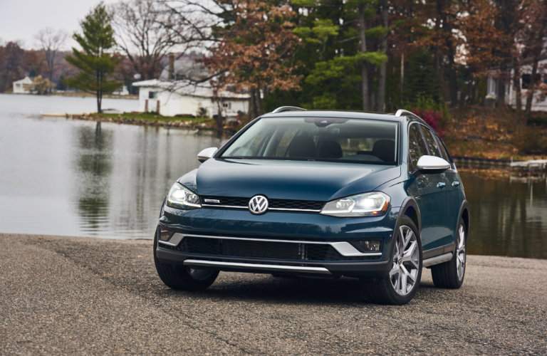 2018 Volkswagen Golf Alltrack parked on rocks near lake