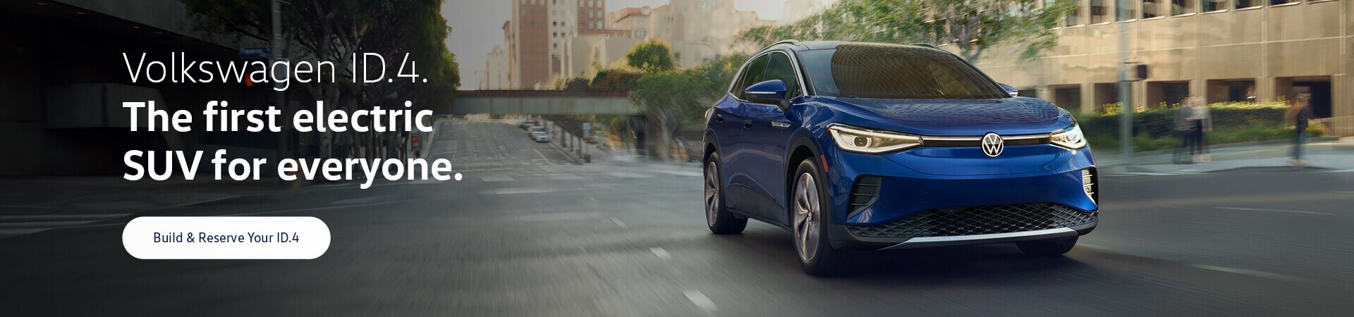 An ID.4 in Dusk Blue Metallic drives on an urban road.