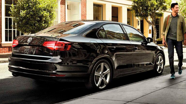 black 2019 vw jetta parked in city