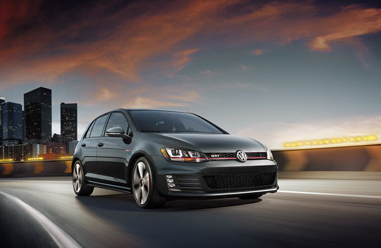 Golf GTI driving in city landscape