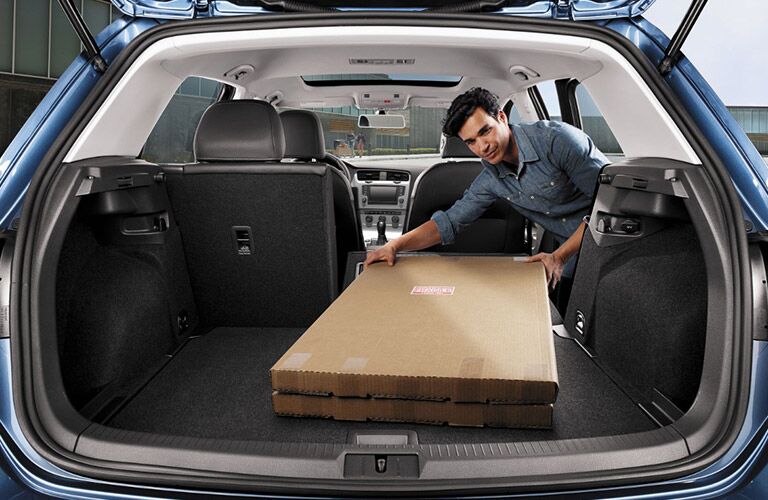 2017 Volkswagen Golf folding down seats and loading cargo