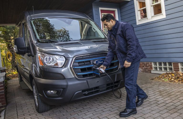 Man Plugging in a 2023 Ford E-Transit