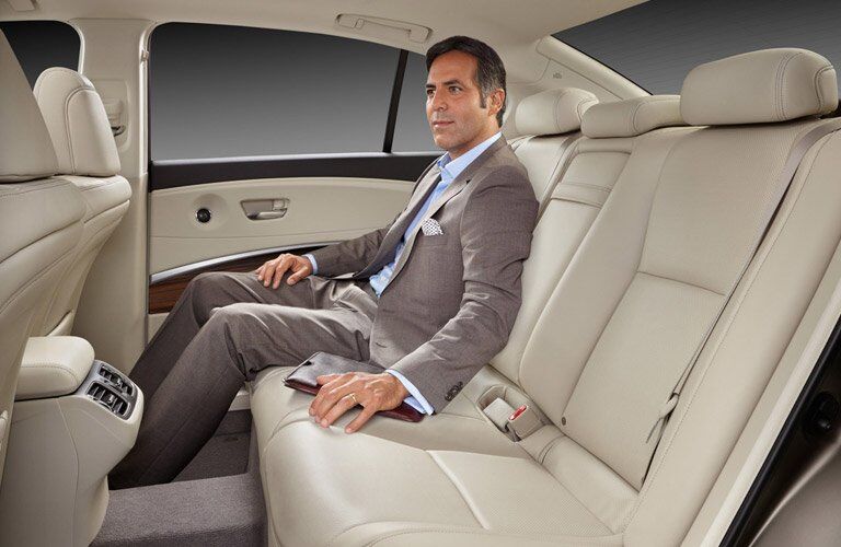 Used Acura RLX back seat with man in it