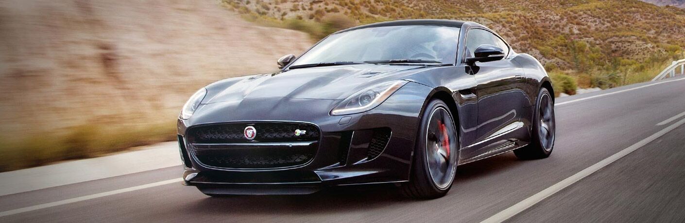 Black 2017 Jaguar F-TYPE on a Country Highway