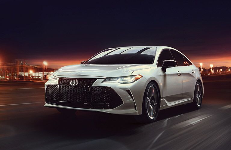 White 2019 Toyota Avalon on a City Street at Night