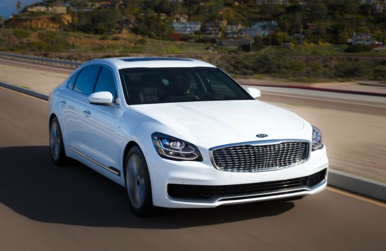 White 2019 Kia K900 on a Highway