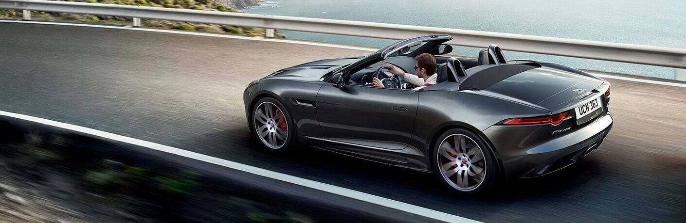 Gray 2020 Jaguar F-TYPE Convertible on Coast Road with Top Down