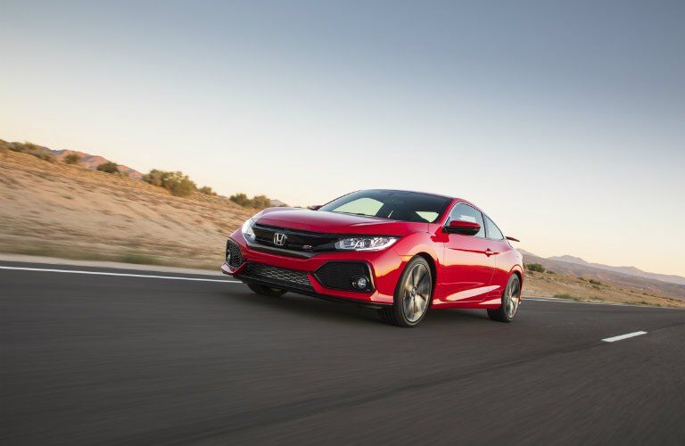 2017 Honda Civic Si driving down the road