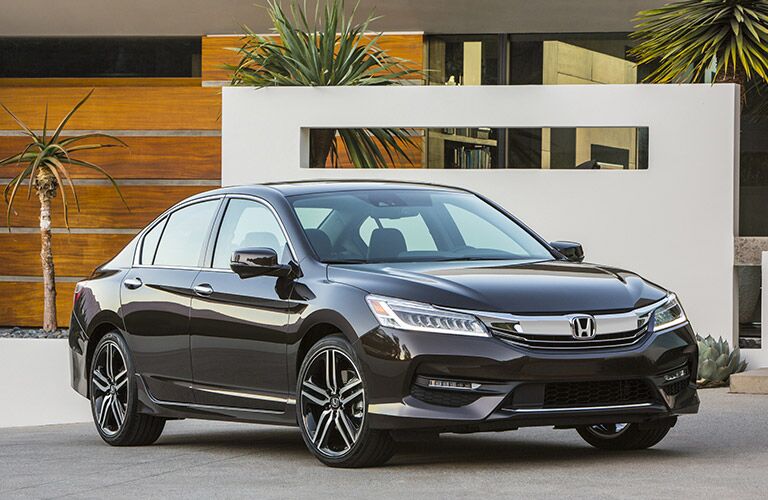 Black Honda Accord parked outside a modern California house.