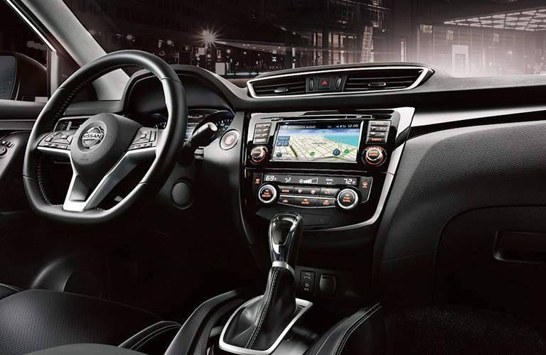 steering wheel and infotainment system in the 2017 Nissan Rogue Sport