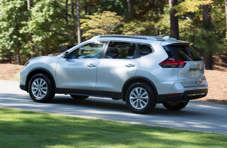 while 2017 Nissan Rogue driving on street
