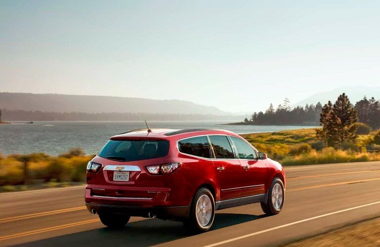 2017 Chevy Traverse red from the back driving