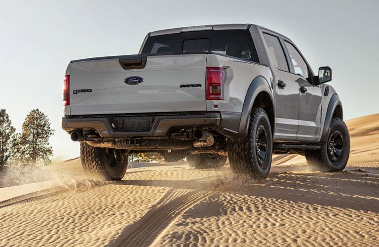 2017 Ford F-150 Raptor from the rear over sand