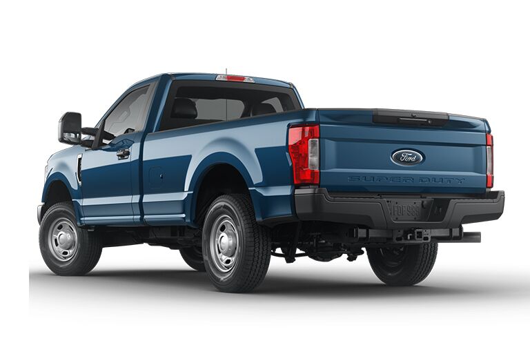 2019 Ford F 350 Super Duty Vs 2018 Ram 3500 Rear View Of A Blue 2019 Ford F 350 Super Duty