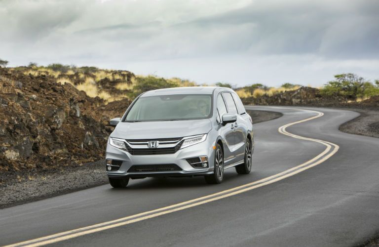 A front photo of the 2019 Honda Odyssey on the road.