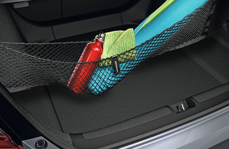 An interior photo of the 2018 Accord showing one of the cargo storage solutions in the trunk.