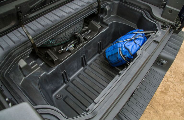 A photo of the lockable storage compartment in the cargo bed of the 2019 Honda Ridgeline.