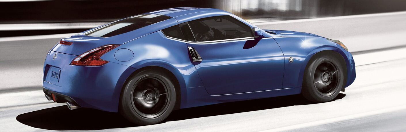 rear and side view of blue nissan 370z coupe