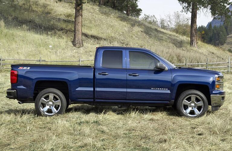 Blue 2016 Chevy Silverado in farm country