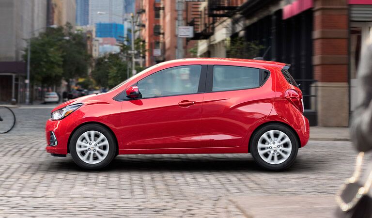 Red Chevy Spark is very tiny but very efficient and affordable