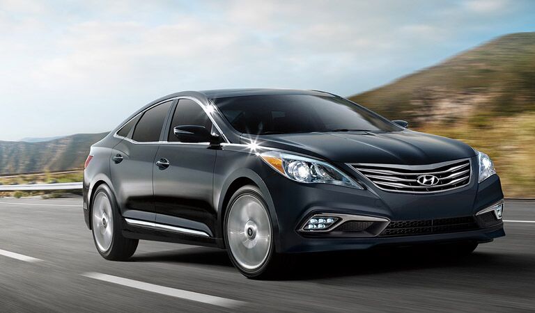 black 2016 Hyundai Azera driving fast on the road